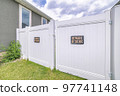 White vinyl fence gate with two beware of dog the signages 97741148