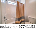 Traditional bathroom with brown shower curtain with black stripes 97741152