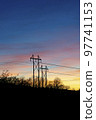Silhoutte of transmission towers against the sunset night sky at Provo in Utah 97741153