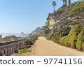 Train track and dirt road at the beach of San Clemente, California 97741156