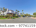 Intersection road in a residential area with mediterranean style houses at San Clemente, California 97741159