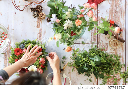 Flower arrangement using fresh flowers Handmade flower wreath Female flower designer 97741787