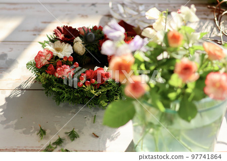 Flower arrangement using fresh flowers Handmade flower wreath Female flower designer Flower arrangement using fresh flowers Handmade flower wreath Female flower designer 97741864