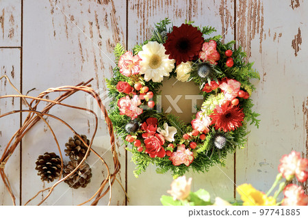 Flower arrangement using fresh flowers Handmade flower wreath Female flower designer 97741885