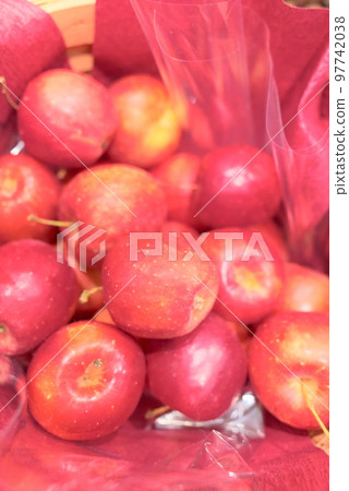 A large amount of princess apples in a basket A large amount of princess apples in a basket 97742038