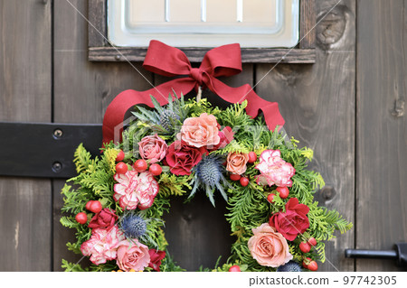 Gorgeous flower arrangement, flower wreath decorated with antique wooden arch door, flower designer Gorgeous flower arrangement, flower wreath decorated with antique wooden arch door, flower designer 97742305