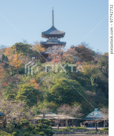 A three-storied pagoda on top of a mountain A three-storied pagoda on top of a mountain 97742732