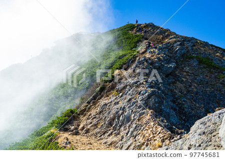 Climbing Yatsugatake in Nagano Prefecture: Aiming for the summit of Mt. Akadake from Jizo no kashira Climbing Yatsugatake in Nagano Prefecture: Aiming for the summit of Mt. Akadake from Jizo no kashira 97745681