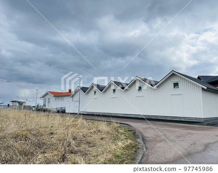 A view of red wooden houses on Vrango Archipelago island . 97745986