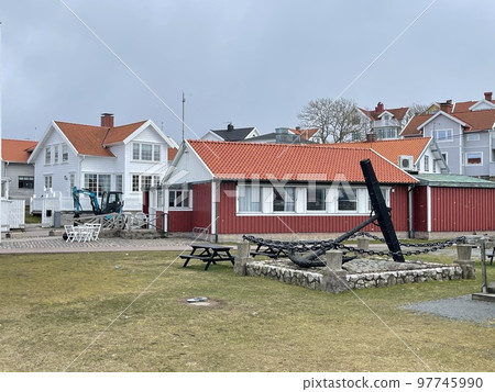 A view of red wooden houses on Donso Archipelago island . 97745990