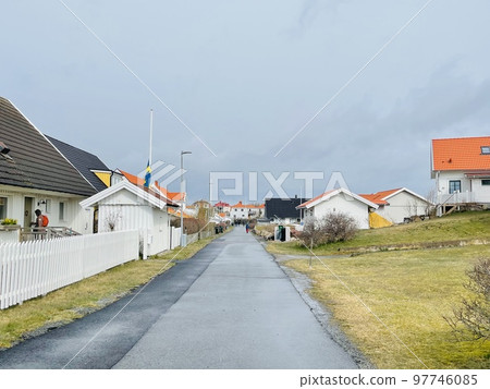 A view of red wooden houses on Vrango Archipelago island . 97746085