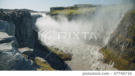 Most powerful watterfall Dettifoss filmed from the distance, Iceland, Europe Most powerful watterfall Dettifoss filmed from the distance, Iceland, Europe 97746716