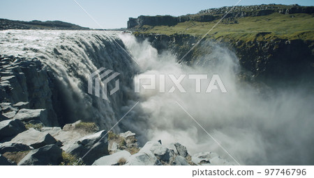 Impressive powerful Dettifoss waterfall with cliff edge in foreground, Iceland, Europe 97746796
