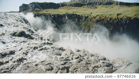 Powerful Dettifoss waterfalk, Riging river water running over the cliff edge, Iceland, Europe 97746816