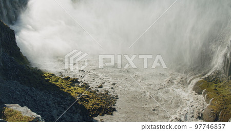 Iceland Riging Dettifoss waterfall and canyon with mountain river, Europe Iceland Riging Dettifoss waterfall and canyon with mountain river, Europe 97746857