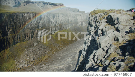 Canyon with mountain river falling from powerful Dettifoss waterfall, Iceland Canyon with mountain river falling from powerful Dettifoss waterfall, Iceland 97746907
