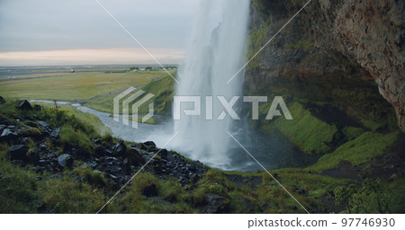 Rear view of Seljalandfoss waterfall Iceland in sunset light 97746930