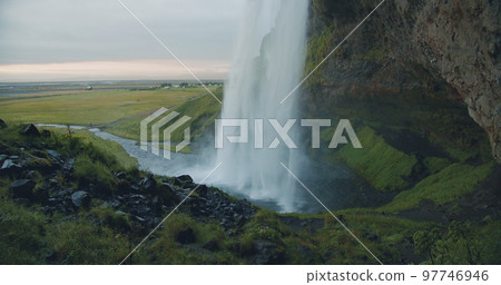 Close up of beautiful Seljalandfoss waterfall by sunset, Iceland Close up of beautiful Seljalandfoss waterfall by sunset, Iceland 97746946