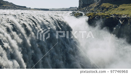 Massive and epic waterfall Dettifoss Riging water volume falling down over the edge Iceland, Europe Massive and epic waterfall Dettifoss Riging water volume falling down over the edge Iceland, Europe 97746968