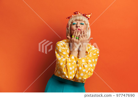 Senior Woman Sending Air Kiss. Beautiful Grandmother Blowing Kiss 97747690