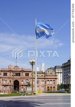Plaza de Mayo in Buenos Aries. Central square in Buenos Aires with the Argentinean flag in the summer next to the presidential palace. Attractions, travel and tourism in Argentina. 97748366