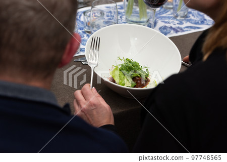 Small portion of meatballs with potato mash and microgreen 97748565