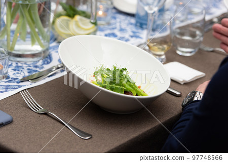 Small portion of meatballs with potato mash and microgreen 97748566