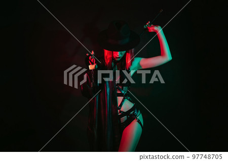 sexy woman in beautiful underwear in a hat holding a leather whip flogger and handcuffs for BDSM sex sexy woman in beautiful underwear in a hat holding a leather whip flogger and handcuffs for BDSM sex 97748705