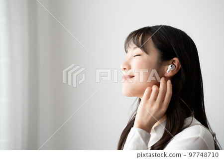 woman immersed in music 97748710