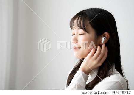 woman immersed in music 97748717
