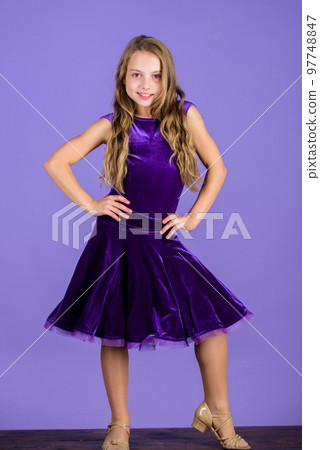 Ballroom fashion. Girl child wear velvet violet dress. Clothes for ballroom dance. Kid fashionable dress looks adorable. Ballroom dancewear fashion concept. Kid dancer satisfied with concert outfit Ballroom fashion. Girl child wear velvet violet dress. Clothes for ballroom dance. Kid fashionable dress looks adorable. Ballroom dancewear fashion concept. Kid dancer satisfied with concert outfit 97748847
