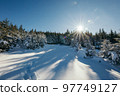 A snow covered road travel 97749127