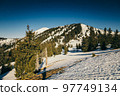 Winter mountains in the snow, coniferous forest, spring, snow-capped peak 97749134