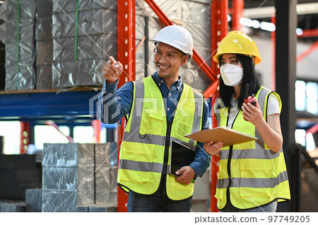 Storehouse workers are checking stock and inventory in retail warehouse. Business factory industry concept 97749205