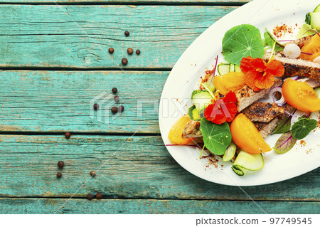 Bright salad with grilled meat steak. 97749545