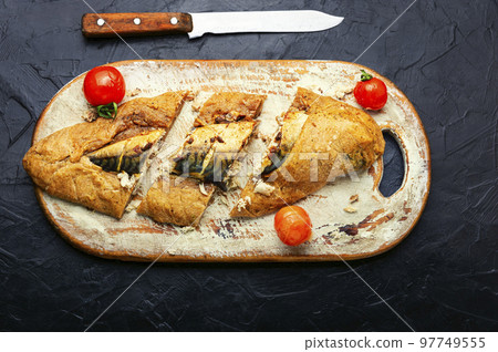 Scomber fish baked in dough. Scomber fish baked in dough. 97749555