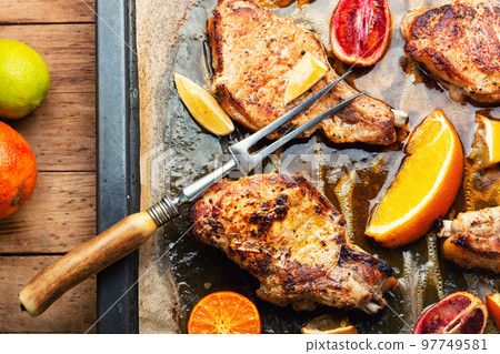 Meat steak fried with citrus fruits. Meat steak fried with citrus fruits. 97749581