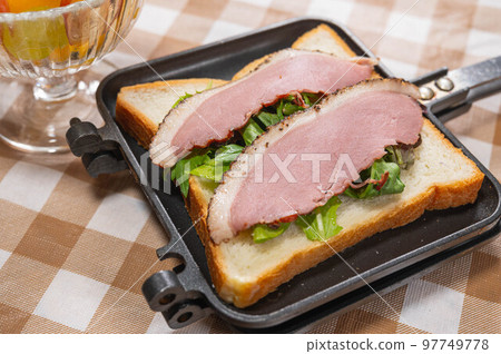 Making hot sandwiches with duck loin Making hot sandwiches with duck loin 97749778