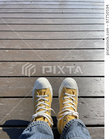 yellow sneakers and floor 97750594