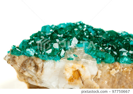 Macro mineral stone Dioptase silicate copper on a white background Macro mineral stone Dioptase silicate copper on a white background 97750667