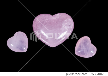 Macro mineral stone Heart pink quartz on a black background Macro mineral stone Heart pink quartz on a black background 97750829