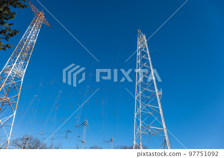 A radio tower in the blue sky A radio tower in the blue sky 97751092