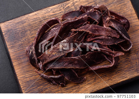 Delicious salted dried beef cut into slices as an appetizer for beer 97751103