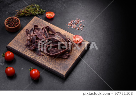 Delicious salted dried beef cut into slices as an appetizer for beer 97751108