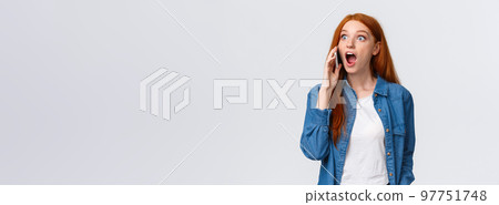 Girl hears amazing great news on phone. Excited lucky redhead girl pick-up phone realises she won challenge, gasping amazed and astonished, holding smartphone near ear, popping eyes surprised Girl hears amazing great news on phone. Excited lucky redhead girl pick-up phone realises she won challenge, gasping amazed and astonished, holding smartphone near ear, popping eyes surprised 97751748