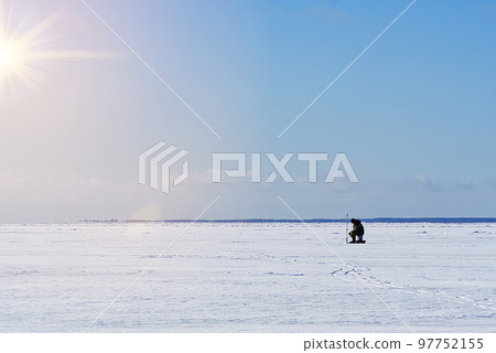 Ice Fishing. Winter fishing on ice at sea, Estonia. Ice Fishing. Winter fishing on ice at sea, Estonia. 97752155