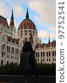 A female tourist stands in front of the Hungarian Parliament Building vertical photo 97752541