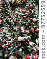 Christmas trees in decorations and snow vertical photo 97752559