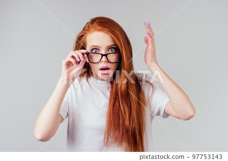 redhaired ginger woman wear glasses in white studio 97753143
