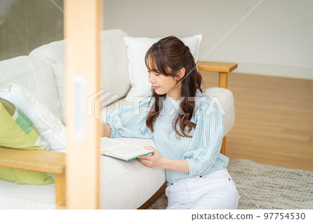 A young woman reading A young woman reading 97754530